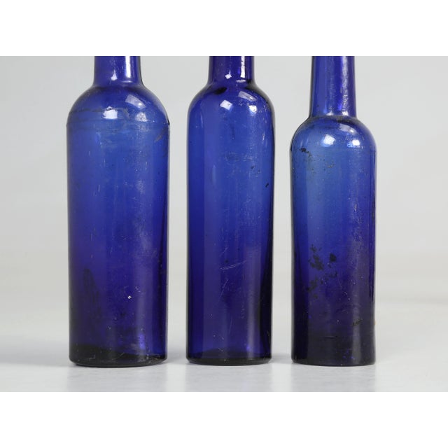Collection of '15' Cobalt Blue Caster Oil Hand Blown Bottles Made in 1800s For Sale - Image 11 of 12