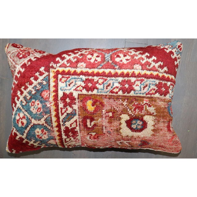 Pillow made from an early 20th century Turkish rug. Measures: 12" x 18''