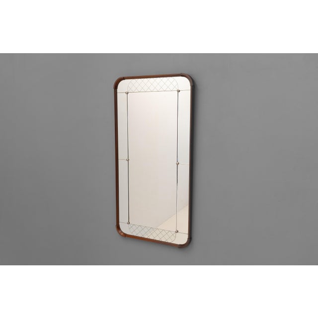 Large size Swedish harlequin mirror with rounded corners in a dark teak frame. Sweden circa 1960.