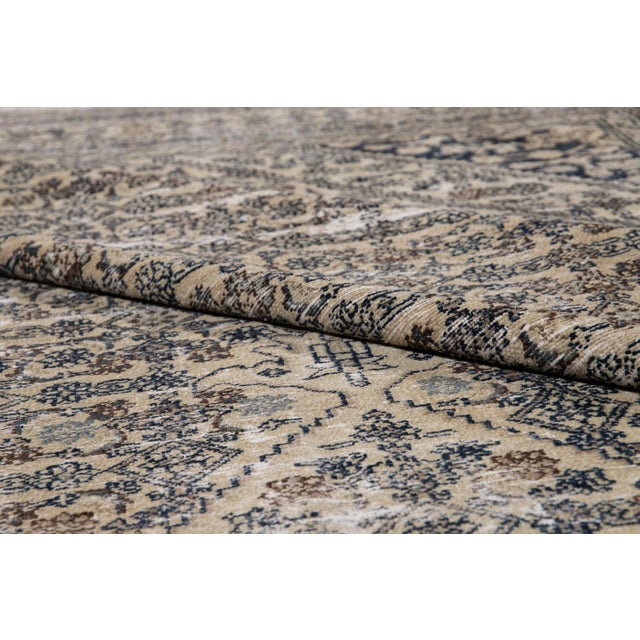 Beautiful vintage Malayer hand-knotted wool rug with a beige field. This Malayer piece has blue and brown accents in an...