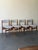 Set of four vintage Danish Mid-Century Modern dining chairs in style of Erik Buch, crafted in beautiful warm teak. These...