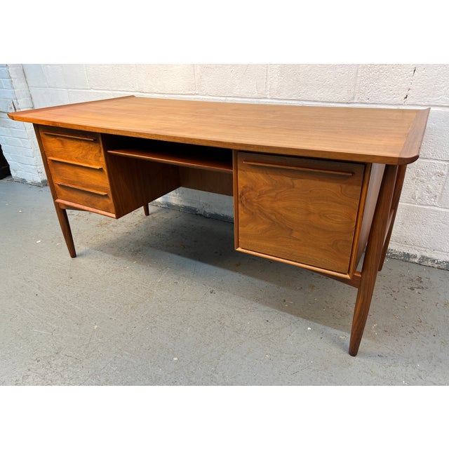 An exceptional example of Danish Modern design, this stunning teak desk was designed by renowned Danish designer Arne...
