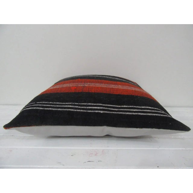 This is a pillow cover made from a vintage kilim rug. The piece was properly washed and ready to use. Pillow inserts not...