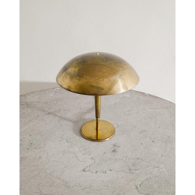 Rare and early Finnish mid century "5061" table lamp in patinated brass and most likely unique edition by Paavo Tynell...