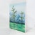 This serene original impressionist landscape painting captures a tranquil nature scene, featuring slender, wind-swept...