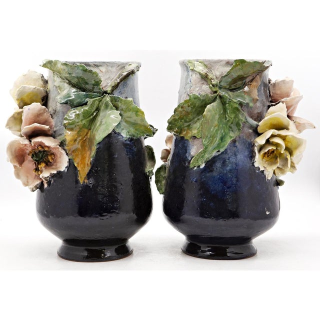 Haviland & co. Manufactory, limoges pair of polychrome painted ceramic vases with high relief floral applications....