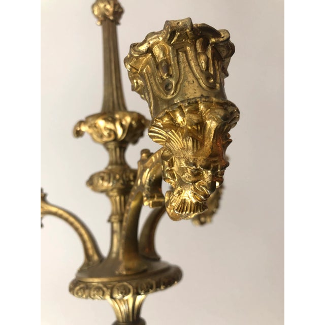 Glistening pair of gilt bronze hanging candelabra chandeliers. Richly decorated with acanthus leaves, floral...