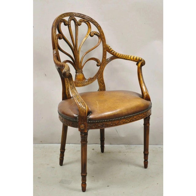 Theodore Alexander Neoclassical Regency Style Carved Mahogany Leather Arm Chair. Item features tooled leather seat, solid...