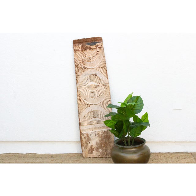 This 68-inch panel is a narrow Igbo wall element, the same collection as door #76, hand-carved from a single slab 16...