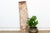 This 68-inch panel is a narrow Igbo wall element, the same collection as door #76, hand-carved from a single slab 16...