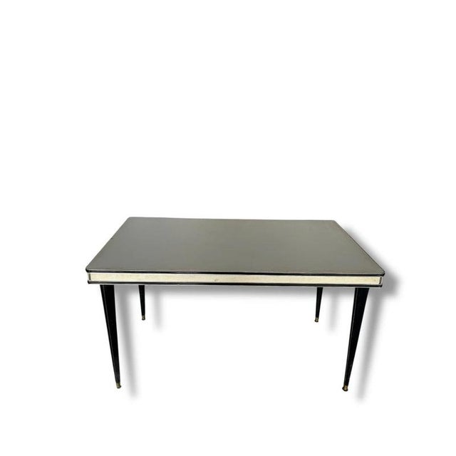 The Vintage Italian Dining Table by Umberto Mascagni brings authentic Italian style and craftsmanship to your home,...
