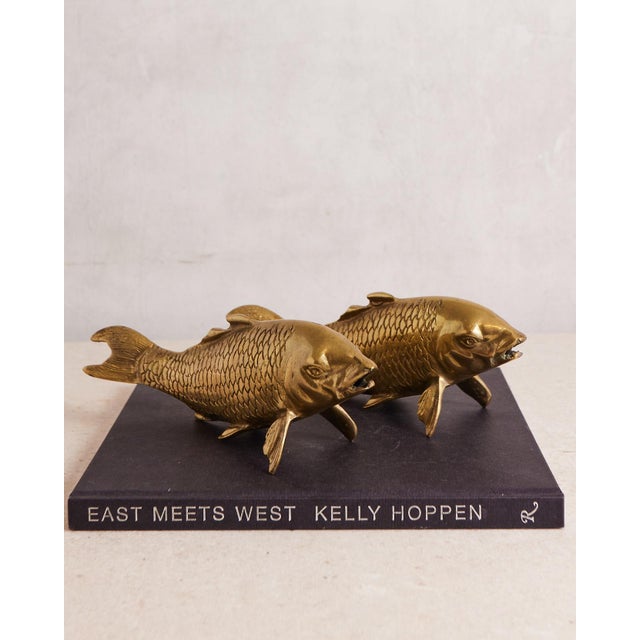Pair of brass koi fish. An excellent duo for coffee table styling. They are the same size (9.5 inches long), and are...