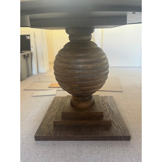 Mr. Brown London 54" "Kent" dining table and base finished in Rustic Oak. Can be used as a dining table seating 6 or a...