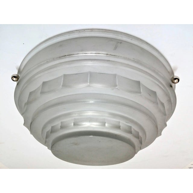 A stunning French Art Deco flush mount that can be turned into a semi pendant chandelier was created in the 1930s by "...