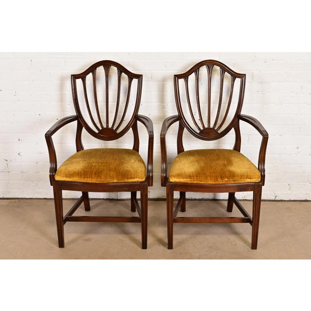 A gorgeous pair of Federal or Hepplewhite style shield back arm chairs or dining captain chairs By Ethan Allen USA, Circa...