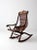 This late 19th century Victorian rocking chair reflects Eastlake influence with its sculpted crest rail, carved arm...