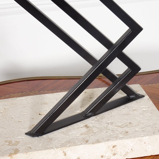 Fantastic postmodern sculptural black iron cantilevered atop travertine base. Attributed to Michael Taylor. Wonderful...