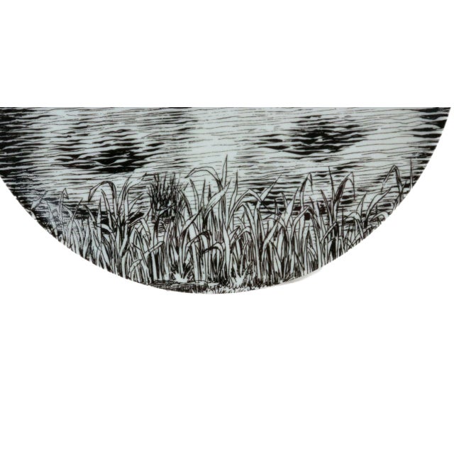 Fornasetti Tema e Variazioni No. 89 Lina Cavalieri Porcelain Plate A face sinking into a lake, and four eyes looking back...