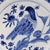 Early 20th century Delft blue & white Bird Charger, Dutch. Large central bird motif with diapered panels alternating with...