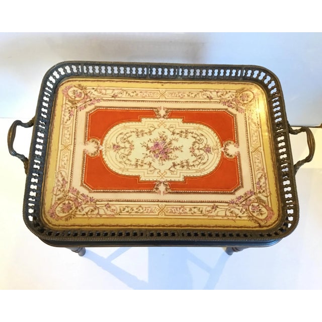 Elegant vintage traditional porcelain and bronze tea table. Pierce bronze detail and handles. Stunning porcelain top....