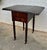 This elegant 19th-century Victorian drop-leaf side table is crafted in richly toned wood, showcasing the warm colour and...