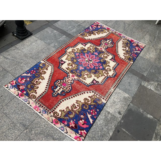 This is a vintage Turkish Oushak rug from the 1960s. The piece was hand-knotted.