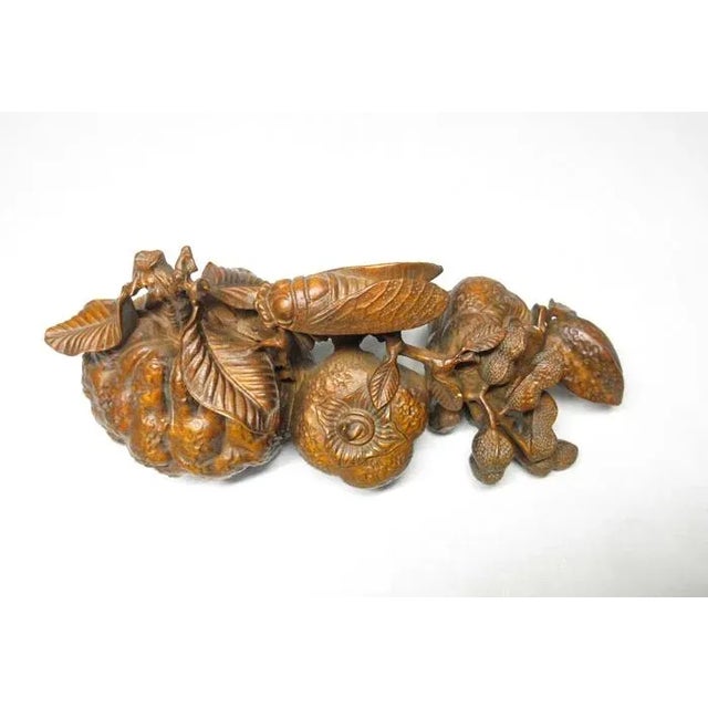 A gorgeous okimono from the later Shōwa period. Intricately carved of beautiful boxwood, okimono are decorative objects...