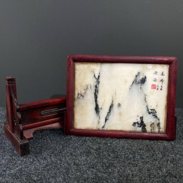 This elegant table screen features a natural marble slab with organic ink-like mountain landscape patterns, set within a...