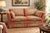 A charming vintage Henredon Schoonbeck loveseat featuring a compact 62-inch frame, softly rolled arms, tailored skirt, and...