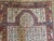 A late 19th century Persian prayer rug with a sweet all-over multicolored floral pattern on a white background surrounded...