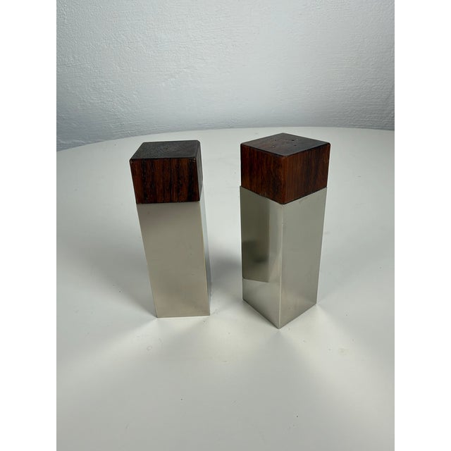 Elegant vintage salt and pepper shaker set featuring a minimalist geometric form characteristic of Scandinavian design...
