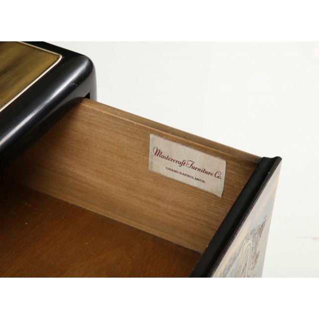 This striking three-drawer commode is a premier example of 1970s Hollywood Regency and Brutalist design, showcasing the...
