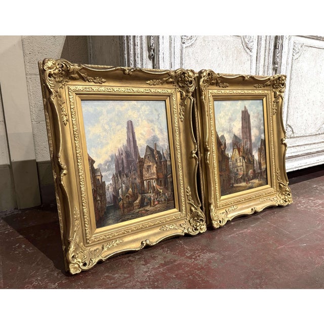 Evoking the picturesque character of historic France, this pair of antique oil paintings presents atmospheric views of...