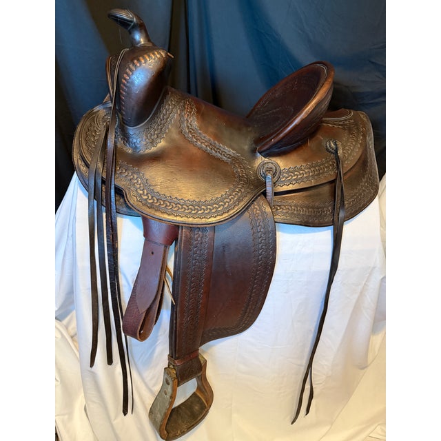 This is a vintage rounded skirt western “bear trap” saddle. The richly toned mahogany-brown leather is stunning with the...
