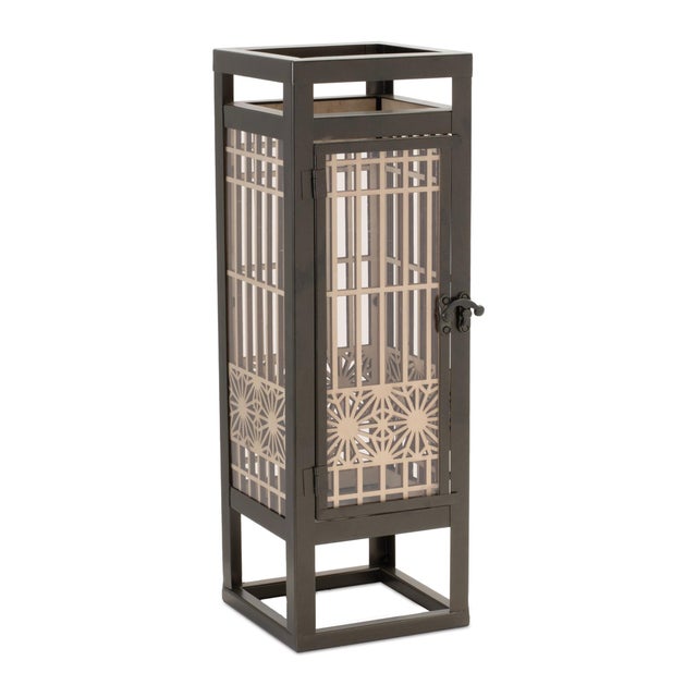 Add a modern, architectural touch to your home with the Cut-Out Wood Candle Holder. Standing 15 inches tall, this candle...