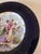 Rosenthal & Co porcelain plate with a scene depicting Cupid and three maidens, possibly titled "Triumph des Amor". The...