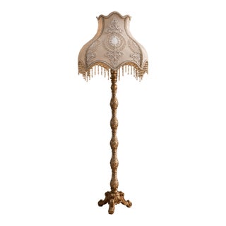 French-Style Gilded Floor Lamp – Ornate Gold Leaf Stand With Embroidered Fabric Shade & Crystal Fringe For Sale