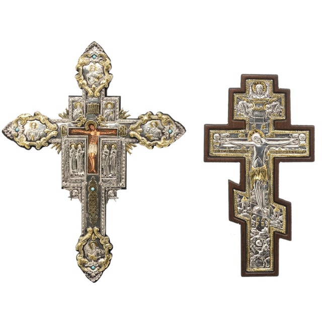 Two orthodox icons with silver plates greek, painted wood, 20th century, representing the crucifixion of jesus christ and...