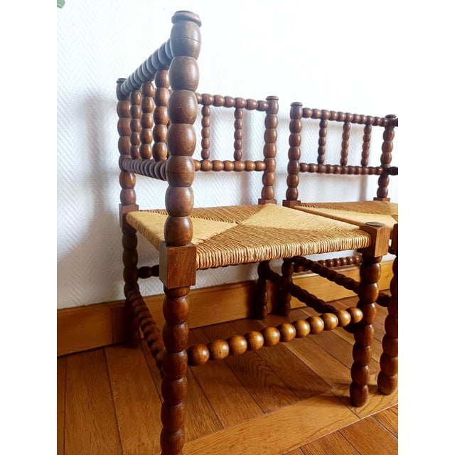 Pair of "spool" chairs, Dutch work circa 1920-1940 Pair of wooden chairs with a turned wood frame reminiscent of a spool....