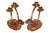 A pair of hand hammered copper swirl candelabra by Craftsman Studios of Laguna Beach, California. A round curled piece of...
