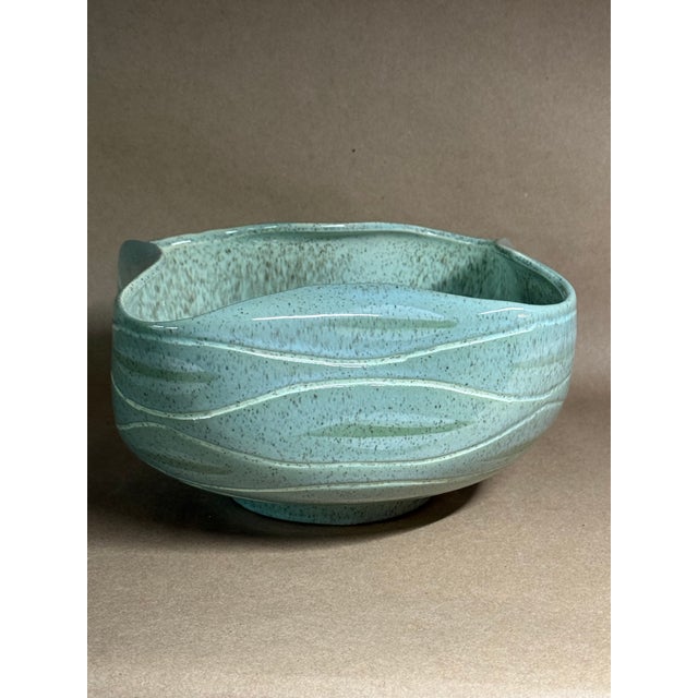 Form #4001 was made by Red Wing Pottery. In 1955, this bowl from the newly created the Sgraffito Line features a finish...