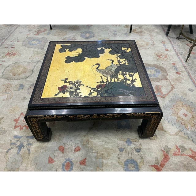 Great vintage Chinese laquer table decorated with beautiful cranes, trees and flowers on gold background. Early to mid...