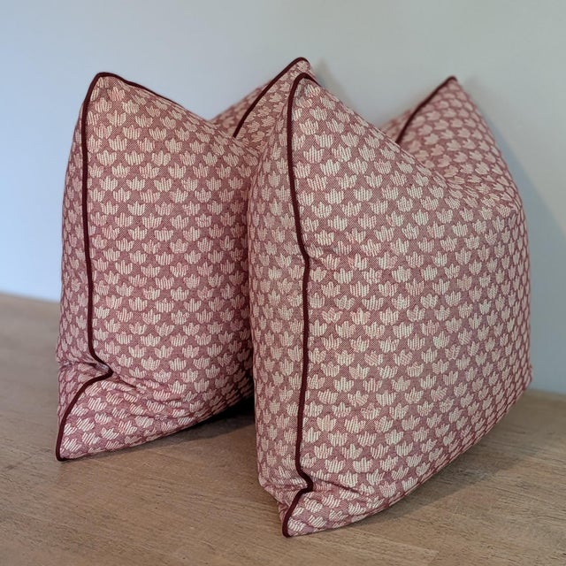 Fermoie Eythorne print pillows in colorway 001, which is a muted red on a cream background. Printed in England and a...