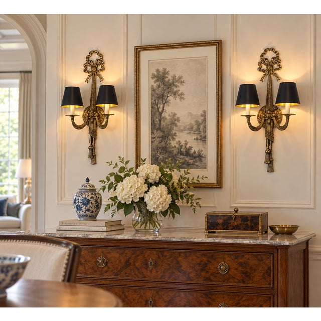 DESCRIPTION: Striking pair of substantial vintage two-light wall sconces with an ornate sculptural design and warm aged...
