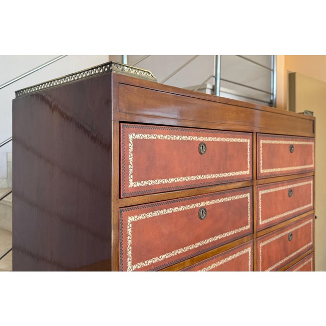 Very rare leather wrapped vintage bachelor chest in the Chippendale Style. This fine piece features 12 dovetailed drawers,...