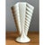 This vase makes a confident architectural statement through its fan-shaped silhouette and deeply articulated ribbed...