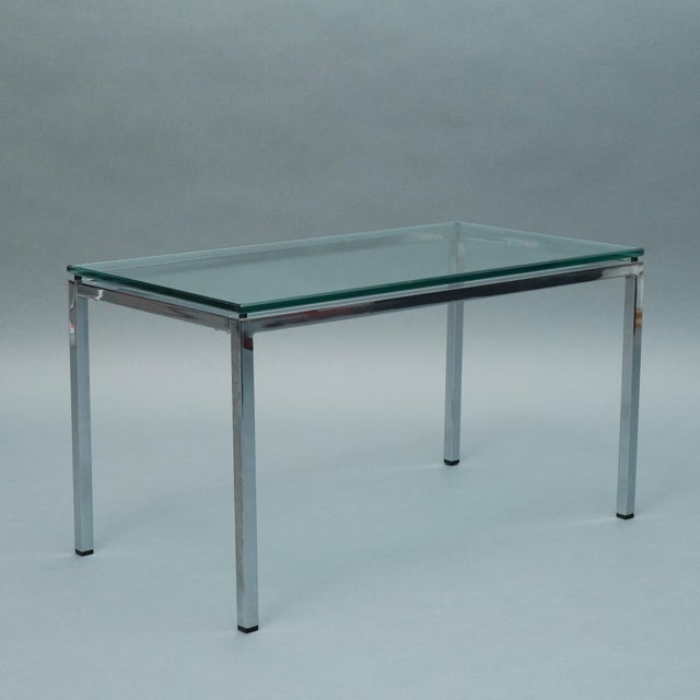 For sale is a steel and glass side table. A functional design in the style of Florece Knoll.
