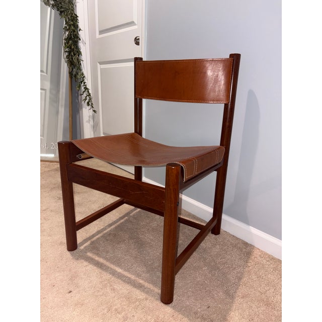 Outstanding set of 6 rare high gloss imbuia wood sling chairs by noted French designer Michel Arnoult (1922-2005). He is...