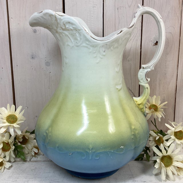 Antique Colonial Pottery ceramic pitcher. Made between 1903-1930. This pitcher has tons of character with unique coloring...
