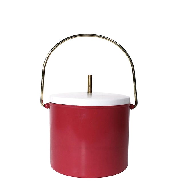 Chic Post Modern, Hollywood Regency ice bucket having a metal exterior in rose pink finish, a metal top in white paint...